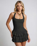 Obsidian Mini Dress by Lauven with tiered ruffle skirt in classic black, showcasing a sleek sleeveless design.