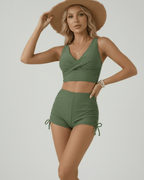 Oliva Two-Piece Swimsuit by Lauven in green featuring a stylish sleeveless top and high-waisted shorts.