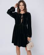 Onyx Mini Dress by Lauven, featuring a black velvet fabric, lantern sleeves, and drawstring detail.
