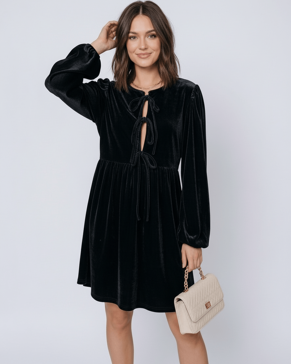 Onyx Mini Dress by Lauven, featuring a black velvet fabric, lantern sleeves, and drawstring detail.