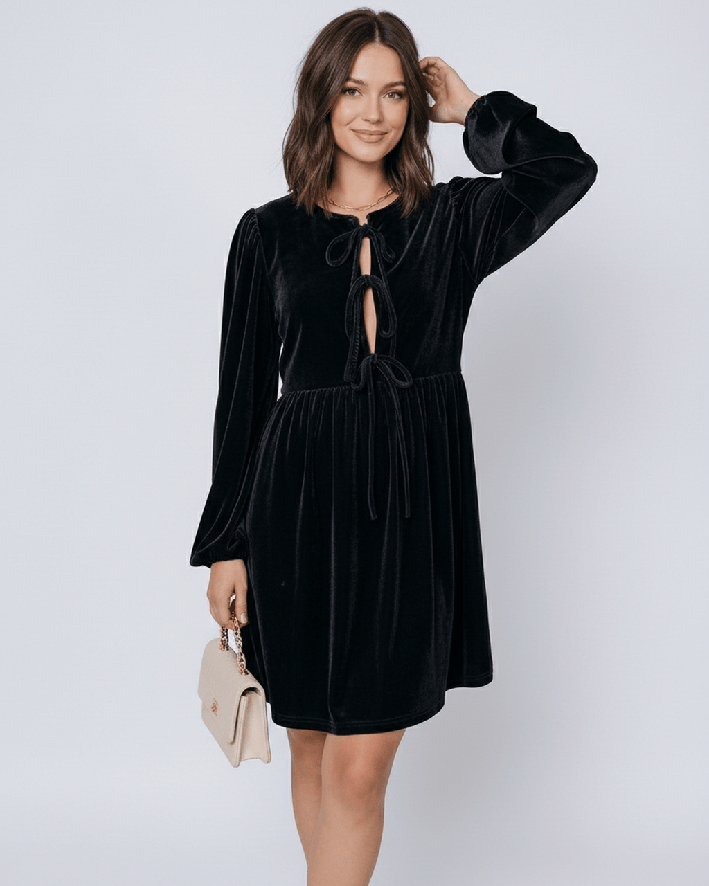 Onyx Mini Dress by Lauven - sleek black velvet dress with lantern sleeves and drawstring detail.