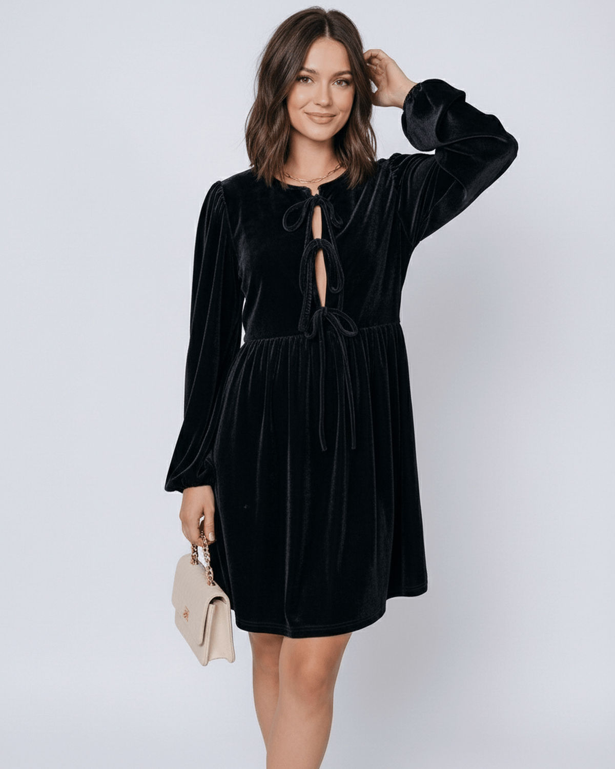 Onyx Mini Dress by Lauven - sleek black velvet dress with lantern sleeves and drawstring detail.