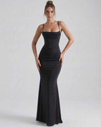 Orion Maxi Dress in sleek black, featuring spaghetti straps and a flattering sheath silhouette by Lauven.