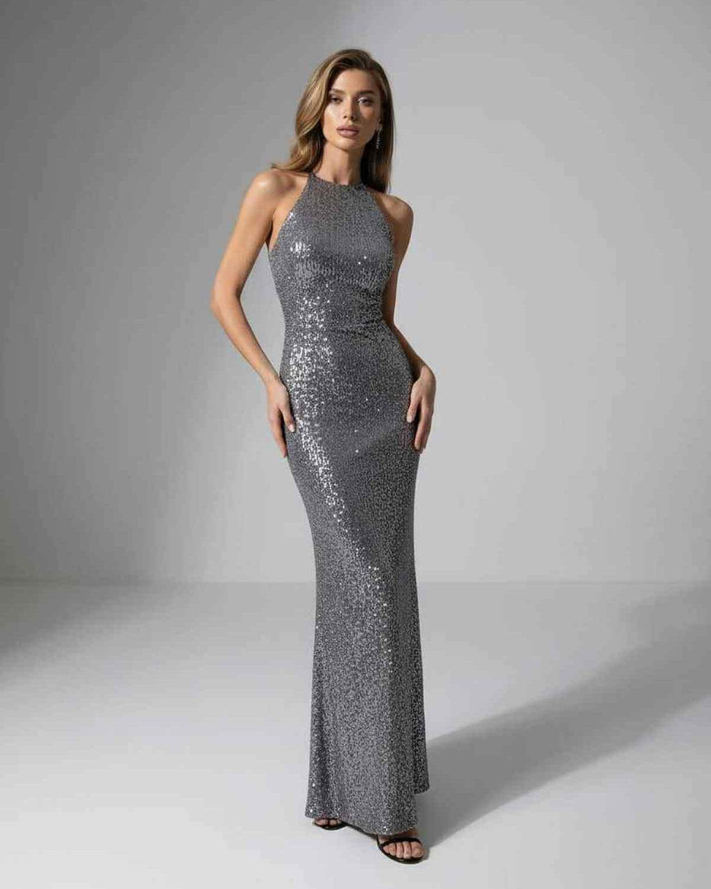 Orion Maxi Dress by Lauven, silver sequin halter neck, showcasing modern elegance and a sleek evening silhouette.