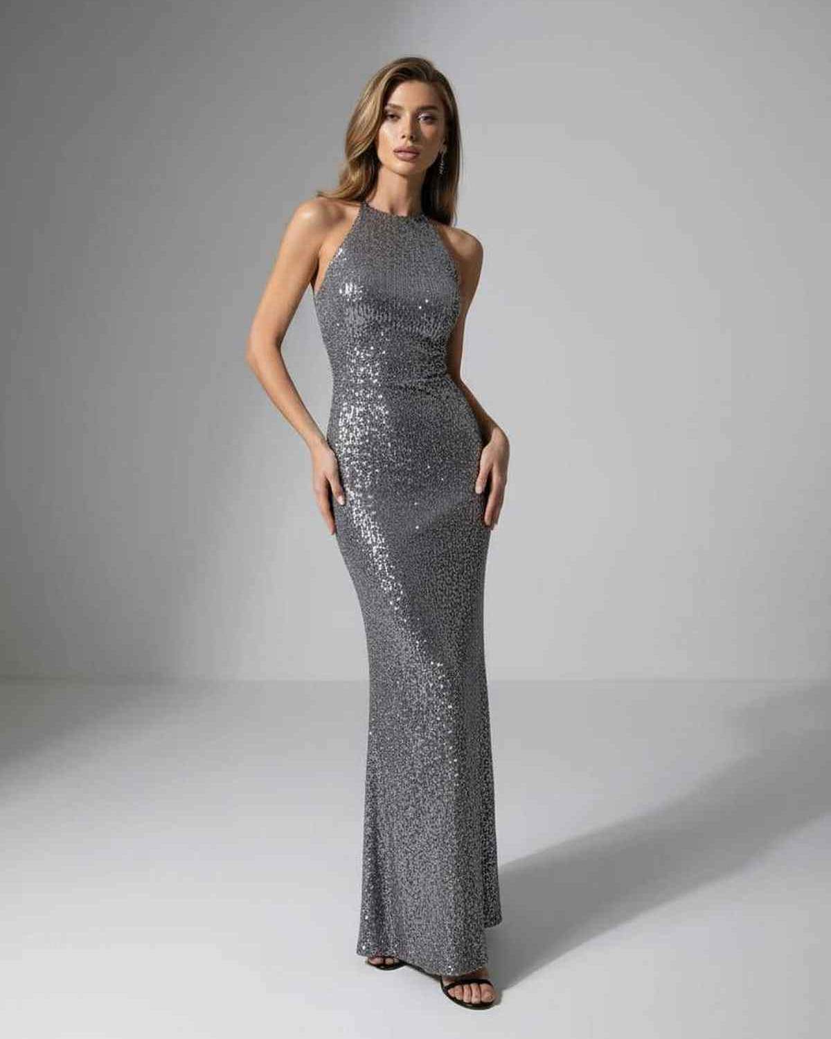 Orion Maxi Dress by Lauven, silver sequin halter neck, showcasing modern elegance and a sleek evening silhouette.
