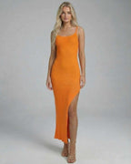 Orion Midi Dress by Lauven, featuring a sleek orange knit design with a high slit for a sophisticated look.