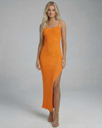 Orion Midi Dress by Lauven in vibrant orange, showcasing a sleek knitted design with a high slit.