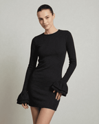 Model wearing the Lauven Orion Mini Dress, an elegant black bodycon dress with ruffled sleeves and a flattering silhouette.
