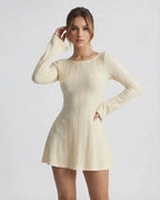 Orion Mini Dress by Lauven, elegant cable knit, soft cream tone, long flared sleeves for a refined style.