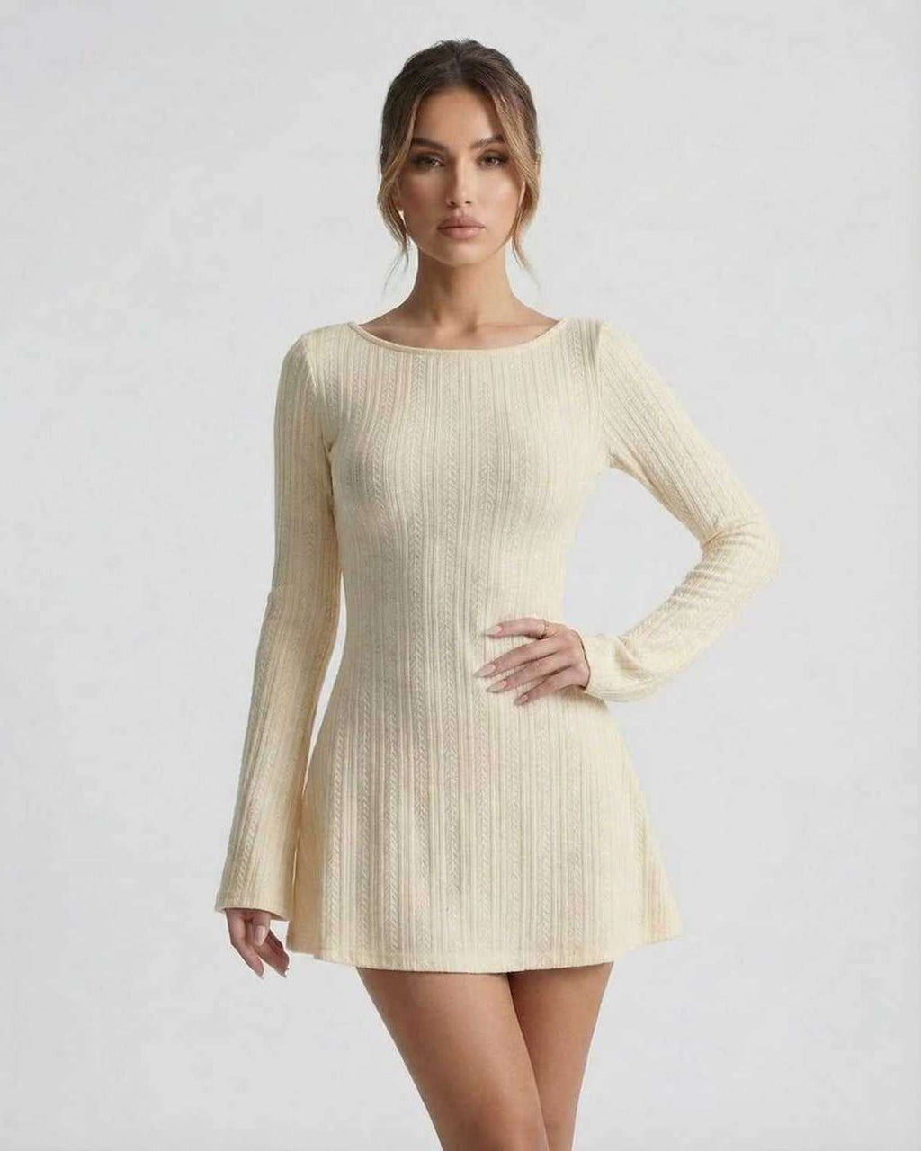 Orion Mini Dress - Elegant long sleeve cable knit mini dress by Lauven, featuring a soft cream tone and a cozy silhouette.