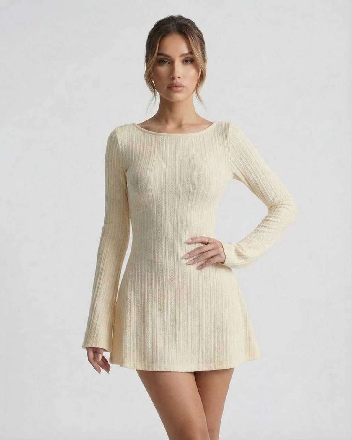 Orion Mini Dress - Elegant long sleeve cable knit mini dress by Lauven, featuring a soft cream tone and a cozy silhouette.