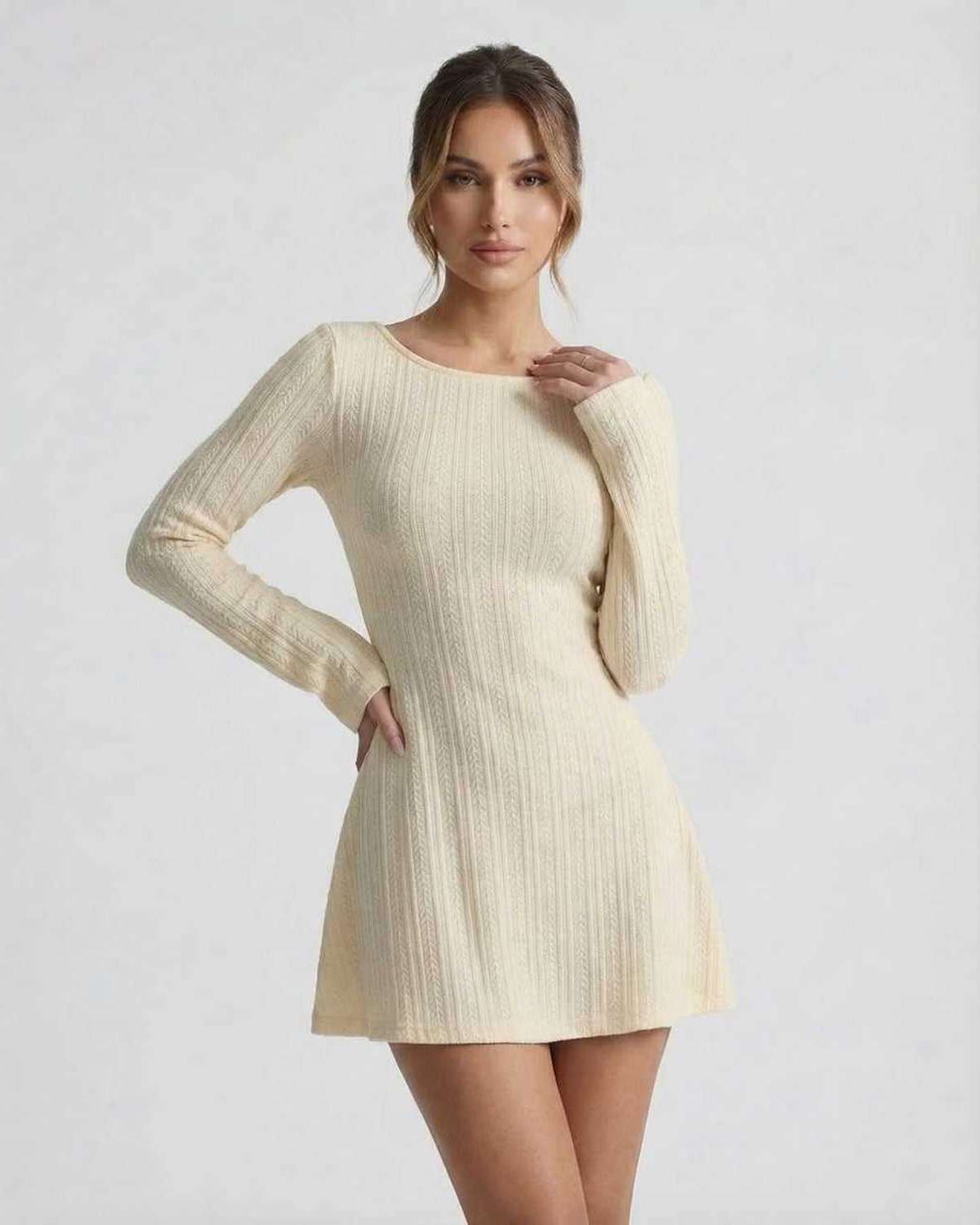 Orion Mini Dress by Lauven featuring a cream cable knit design, long sleeves, and a cozy, elegant silhouette.
