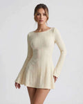 Orion Mini Dress by Lauven, elegant cable knit design, soft cream tone, textured pattern, long flared sleeves.