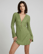 Orion Mini Dress by Lauven, elegant olive green pleated mini dress with long sleeves and deep V-neckline.