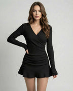 Orion Mini Dress in elegant ribbed black knitwear with deep V-neckline by Lauven for a sophisticated look.
