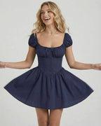 Orion Mini Dress by Lauven, elegant fit and flare design in deep navy with puff sleeves and a flattering silhouette.