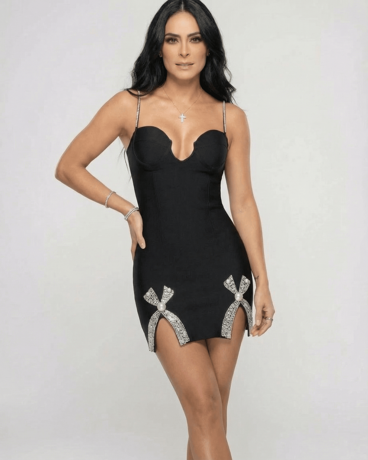 Orion Mini Dress by Lauven featuring a V-neck sheath silhouette with crystal-style embellished slits in black.