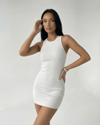 Orion Mini Dress by Lauven – Ribbed knit white mini dress with cross back detail, offering a sleek fit.