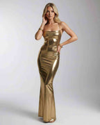Orlena Maxi Dress in gold metallic fabric, features open back and sleek fit, by Lauven for a glamorous look.