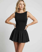Vesper Mini Dress by Lauven — stretch knit sleeveless bateau neck drop waist pleated mini dress