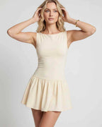Vesper Mini Dress by Lauven — stretch knit sleeveless bateau neck drop waist pleated mini dress