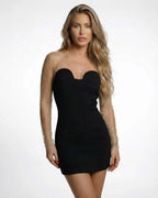 Lauven Eestella Mini Dress features sheer embellished sleeves and a sleek black silhouette for a glamorous look.