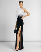 Celeste Maxi Dress by Lauven, featuring a feathered halter neckline and sleek black silhouette.