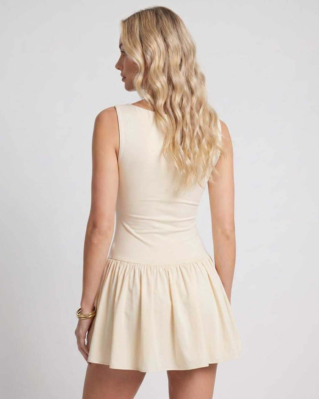 Vesper Mini Dress by Lauven — stretch knit sleeveless bateau neck drop waist pleated mini dress