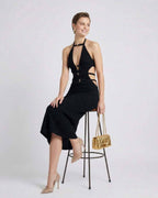 Elegant woman wearing a sleek black Nova Midi Dress from Lauven, featuring a V-neckline and stylish A-line silhouette.