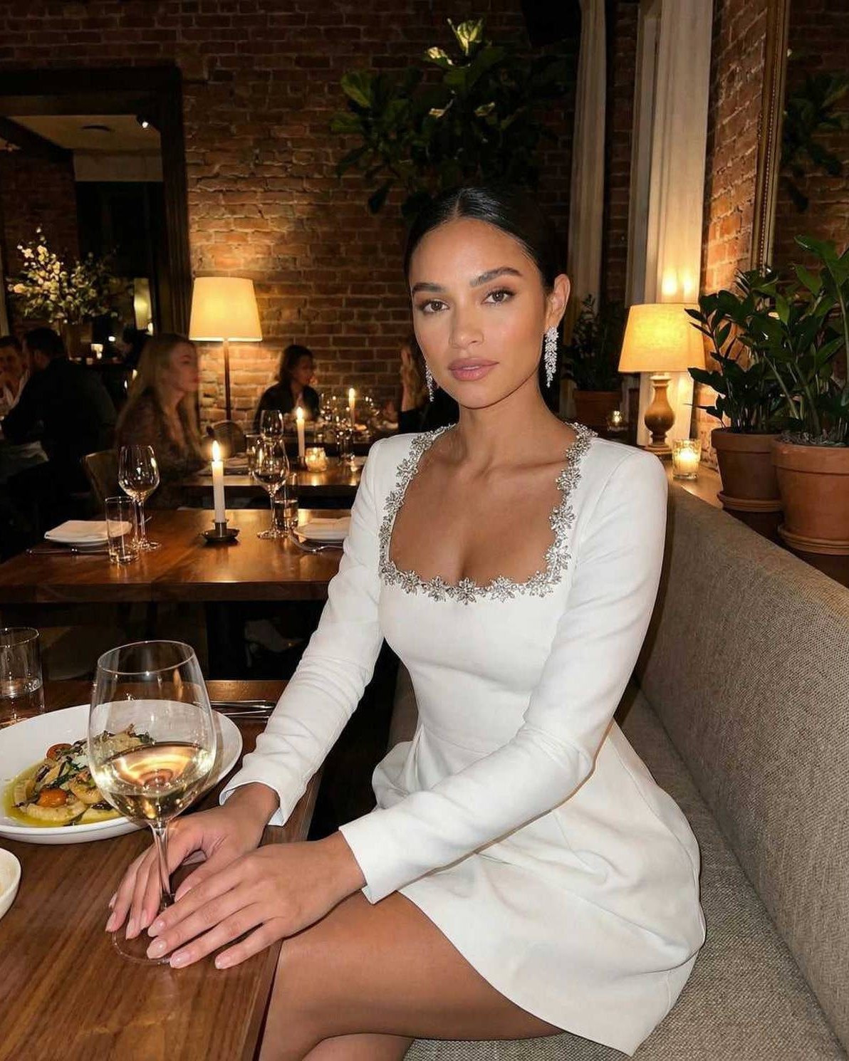 Serena Mini Dress by Lauven, featuring elegant square collar and A-line silhouette, worn at a classy dinner setting.