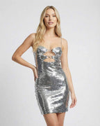 Celeste Mini Dress by Lauven featuring silver sequins, sleeveless design, and double-ring cutouts for a bold look.