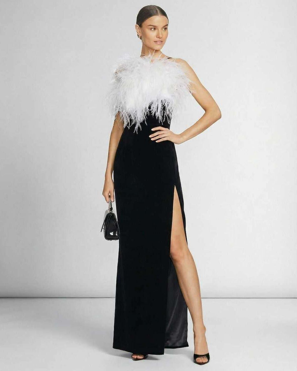 Celeste Maxi Dress by Lauven featuring feathered halter neckline and sleek black silhouette for formal occasions.