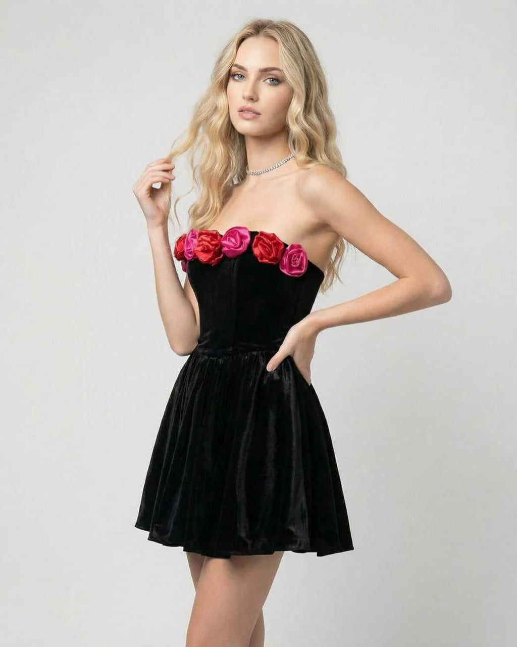 Aurora Mini Dress by Lauven, a velvet strapless floral evening dress in black with vibrant floral appliqués.