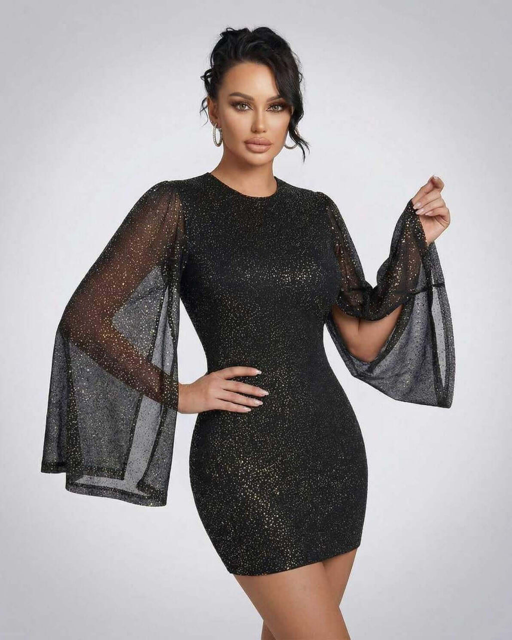 Celeste Mini Dress by Lauven featuring sheer cloak sleeves and sparkling dot pattern for an elegant look.