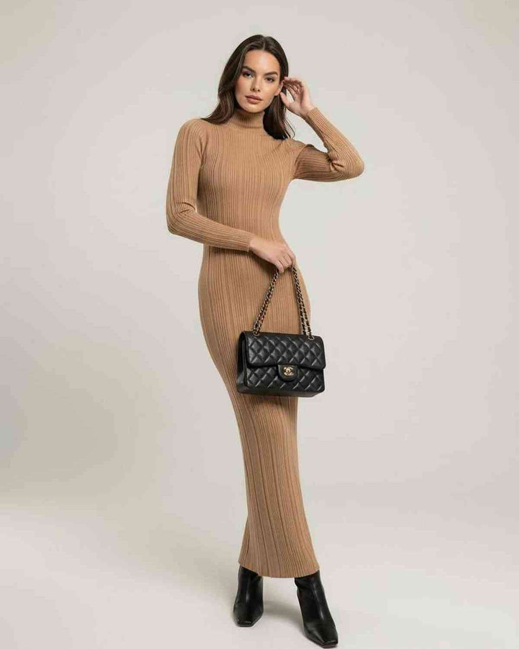 Sienna Maxi Dress worn by model, showcasing beige ribbed knit, turtleneck style, from Lauven brand.
