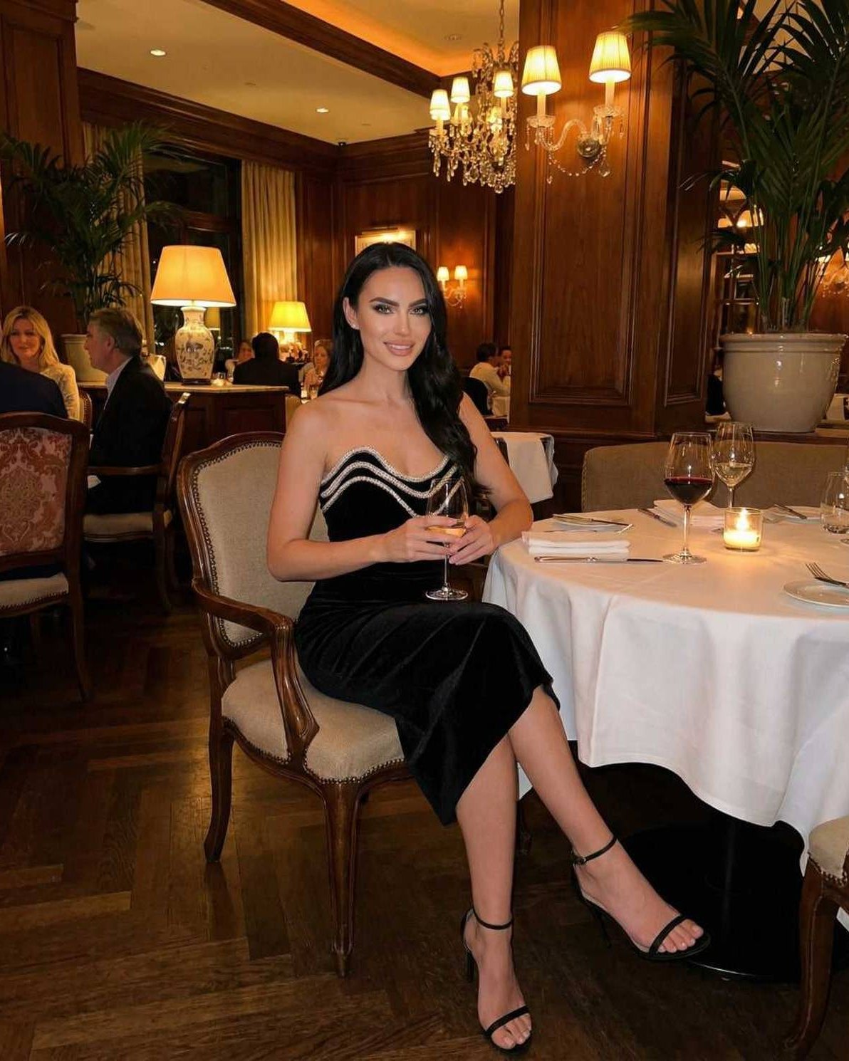 Celeste Midi Dress by Lauven - Elegant strapless velvet dress in a chic dining setting, showcasing sophistication and style.