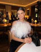 Celeste Maxi Dress by Lauven featuring a feathered halter neckline in a dining setting.