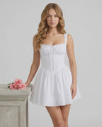 Luna Mini Dress by Lauven, elegant white cotton blend, structured silhouette with pleated skirt.