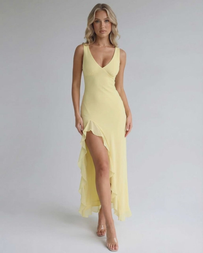 Solara Maxi Dress - Yellow with ruffle slit, flowing silhouette, and elegant design by Lauven. Perfect for summer and formal occasions.