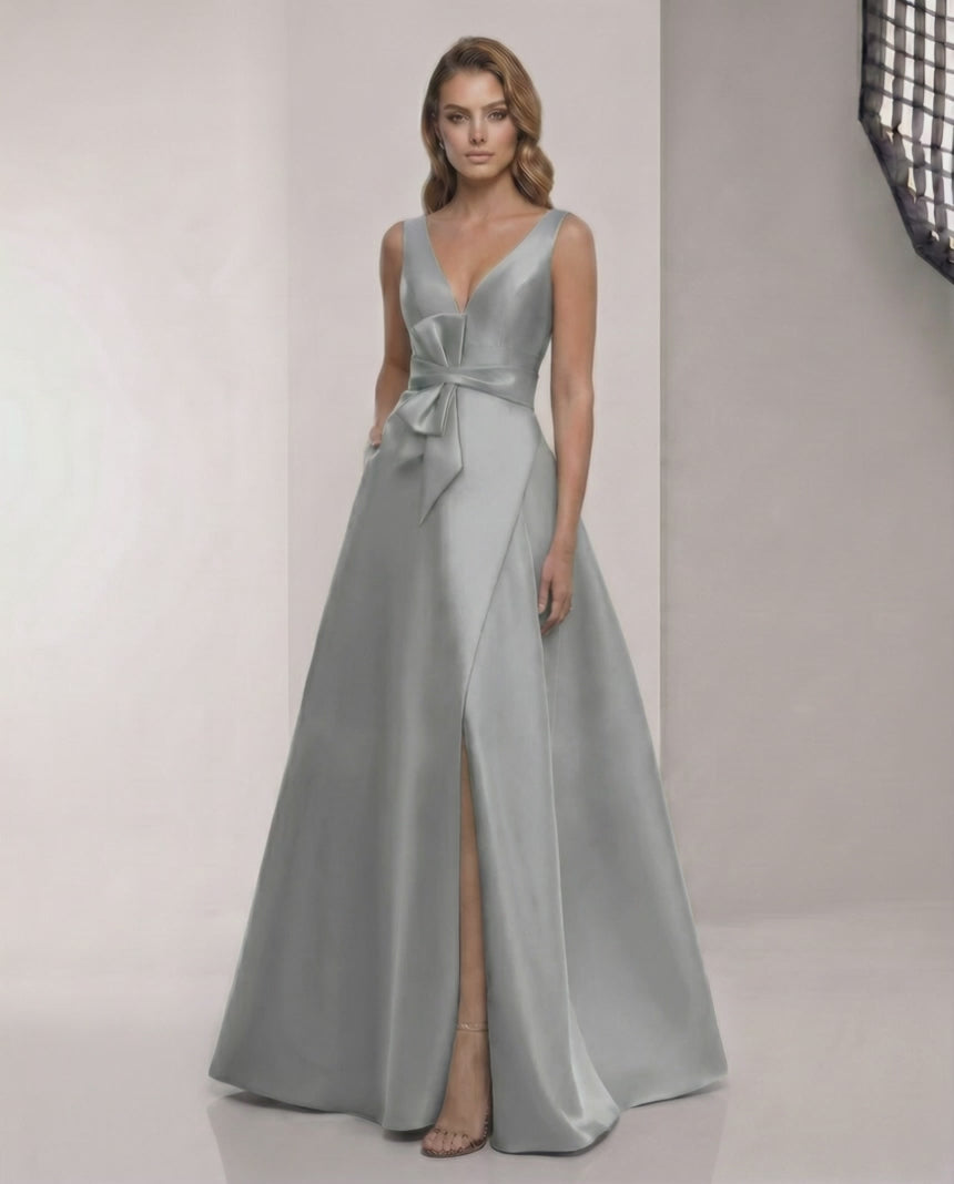 Lunaria Maxi Dress: A-line grey sage satin dress with V-neck, bow detail, and elegant floor-length skirt by Lauven.