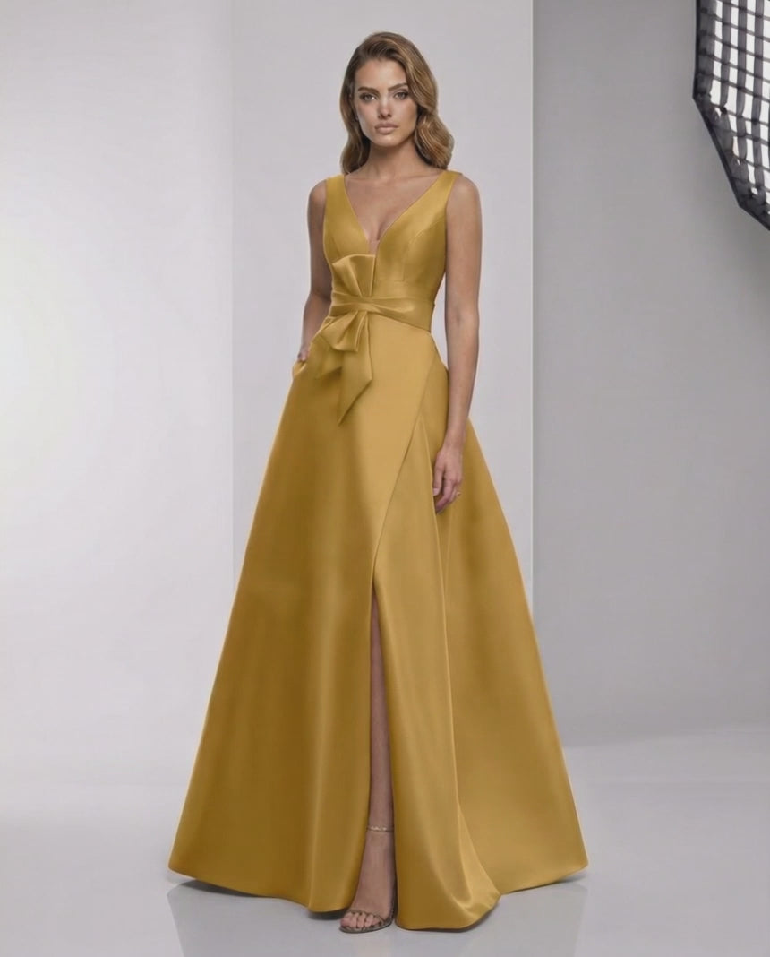 Solenne Maxi Dress - Luxurious satin A-line dress with wrap slit, bow detail, and elegant golden hue by Lauven.