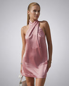Seren Mini Dress by Lauven in soft pink satin with a modern halter neckline, perfect for spring and summer.