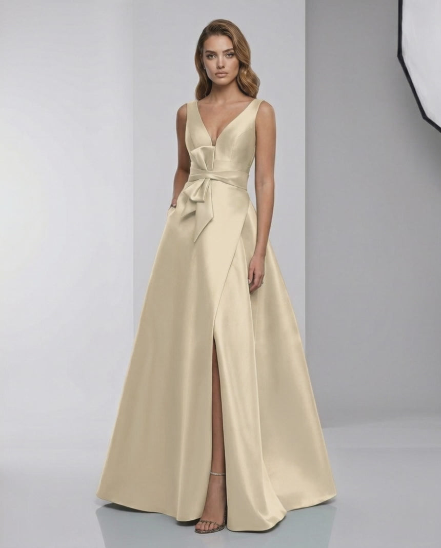 Celeste Maxi Dress in champagne satin, featuring A-line silhouette, V-neckline, and elegant floor-length design by Lauven.