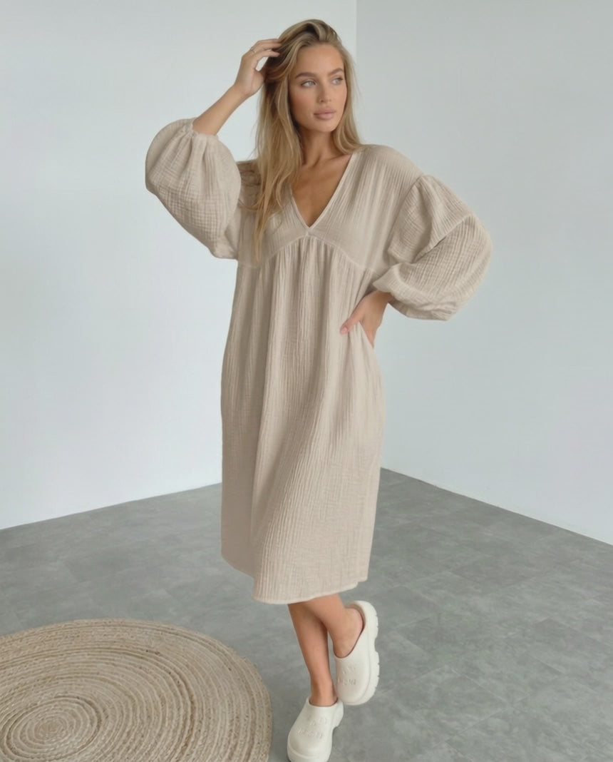 Calista Midi Dress in beige cotton with puff sleeves, embodying modern minimalism and everyday elegance by Lauven.