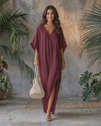 Beautiful woman wearing Solara Maxi Dress in burgundy, lightweight chiffon with V-neck and relaxed silhouette, by Lauven.