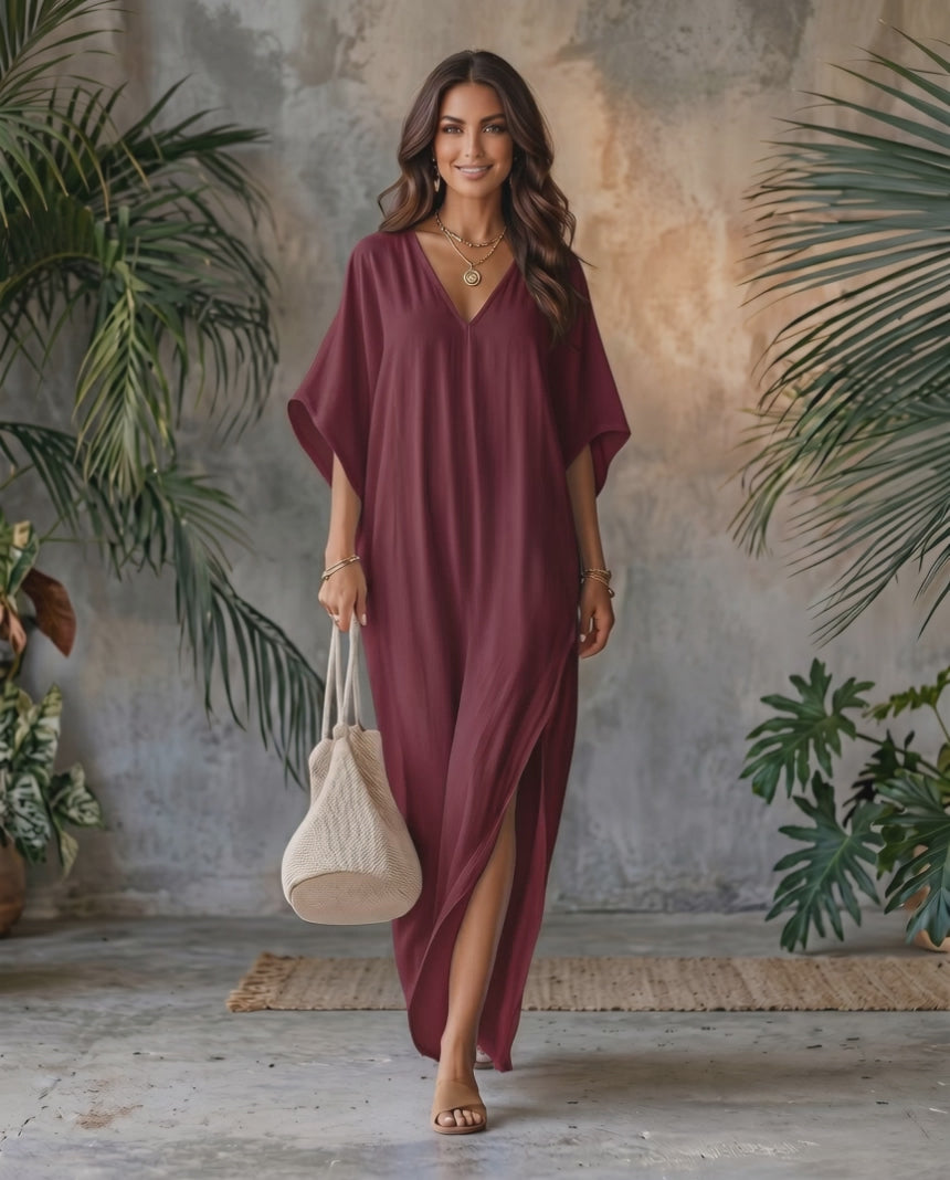 Beautiful woman wearing Solara Maxi Dress in burgundy, lightweight chiffon with V-neck and relaxed silhouette, by Lauven.