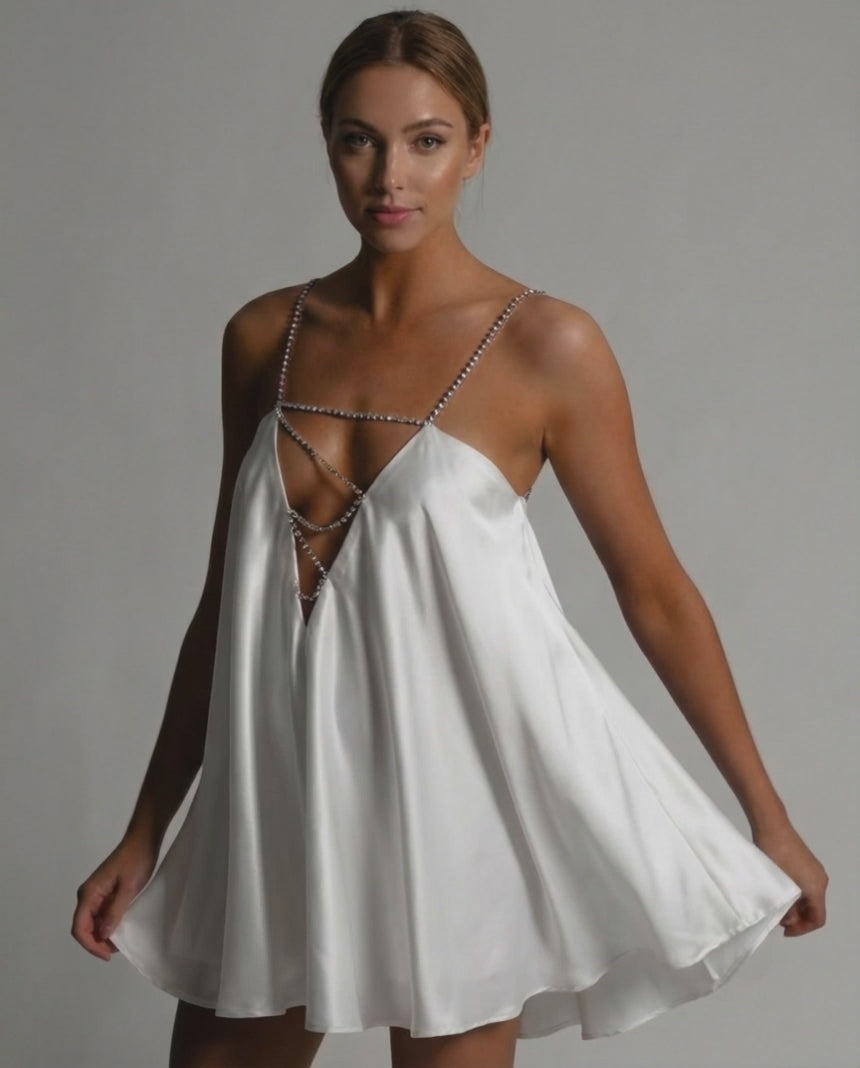 Aurora Mini Dress by Lauven in white satin with beaded straps and flared silhouette, perfect for elegant occasions.