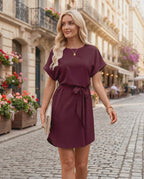 Elara Mini Dress featuring smooth woven fabric, round neckline, relaxed bodice, and self-tie waist by Lauven.