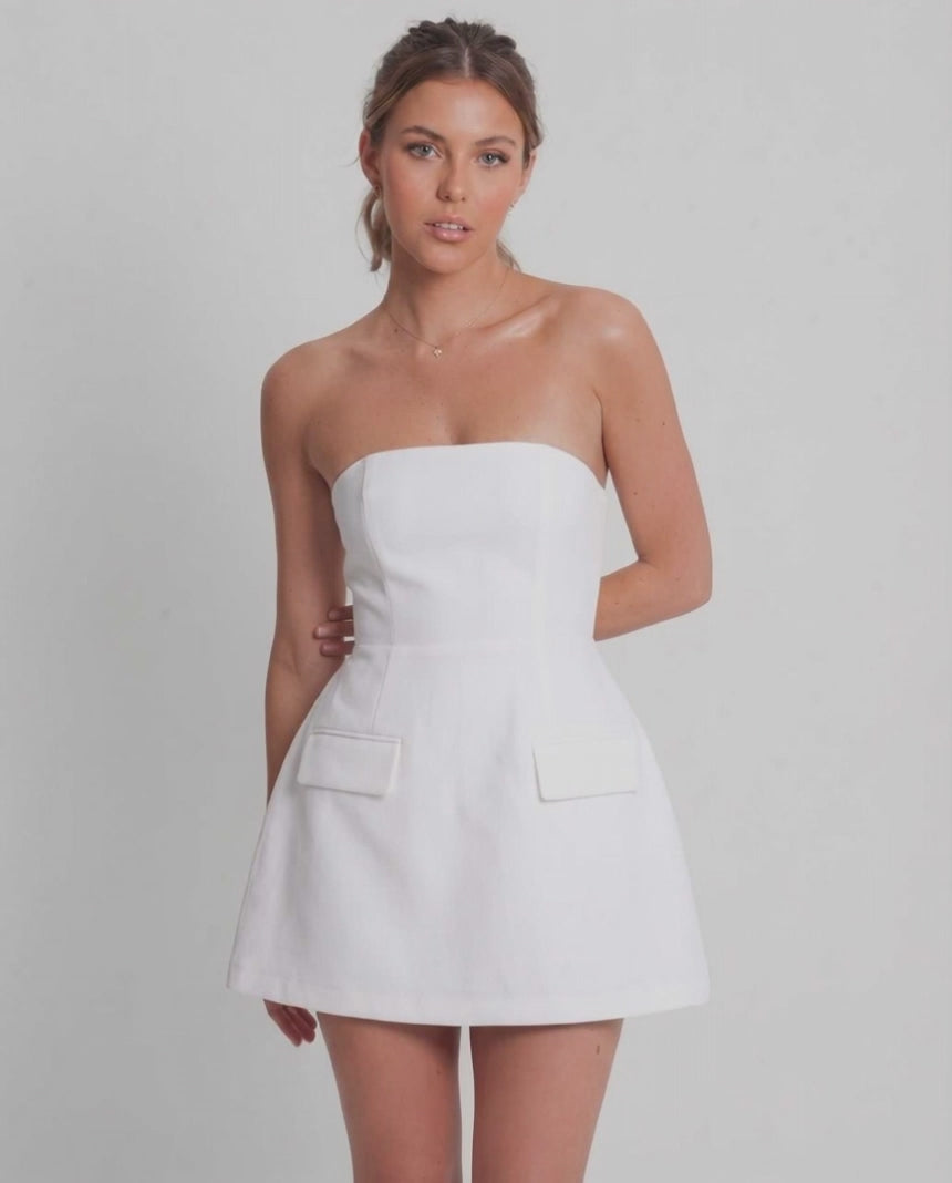Elara Mini Dress | White strapless mini dress with structured A-line silhouette by Lauven, perfect for elevated occasions.