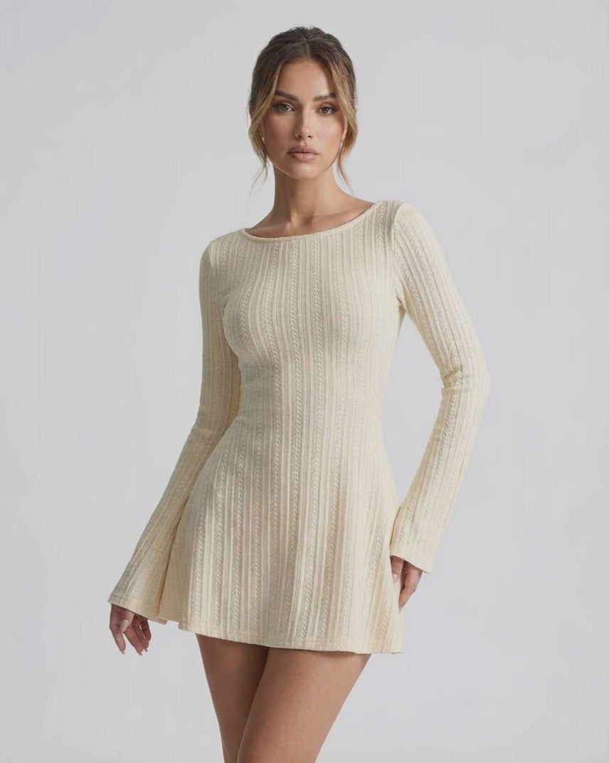 Orion Mini Dress featuring elegant cable knit, long flared sleeves, soft cream tone by Lauven.